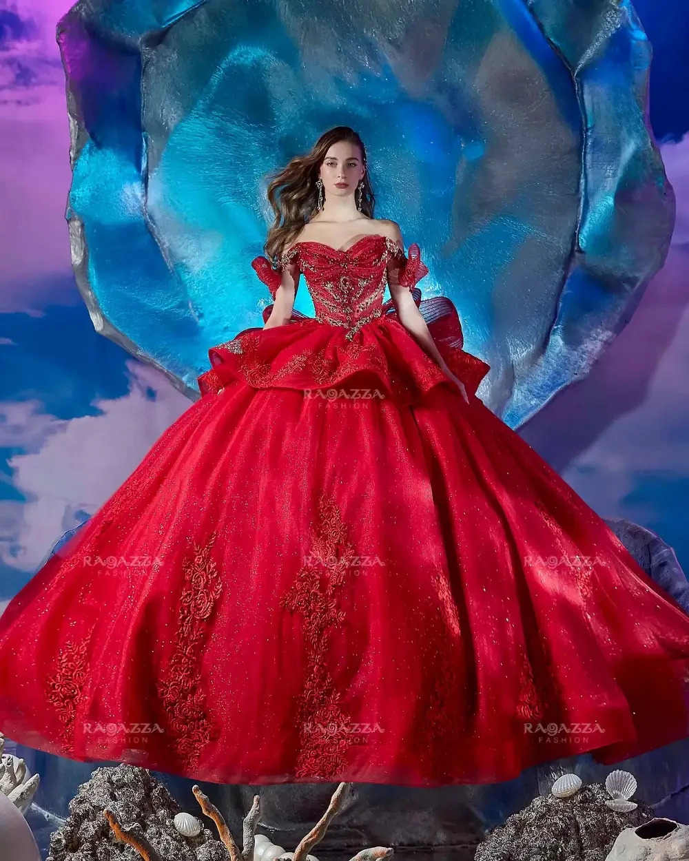 A model in a stunning red gown with intricate details and a dramatic silhouette, posing against a colorful and surreal background.